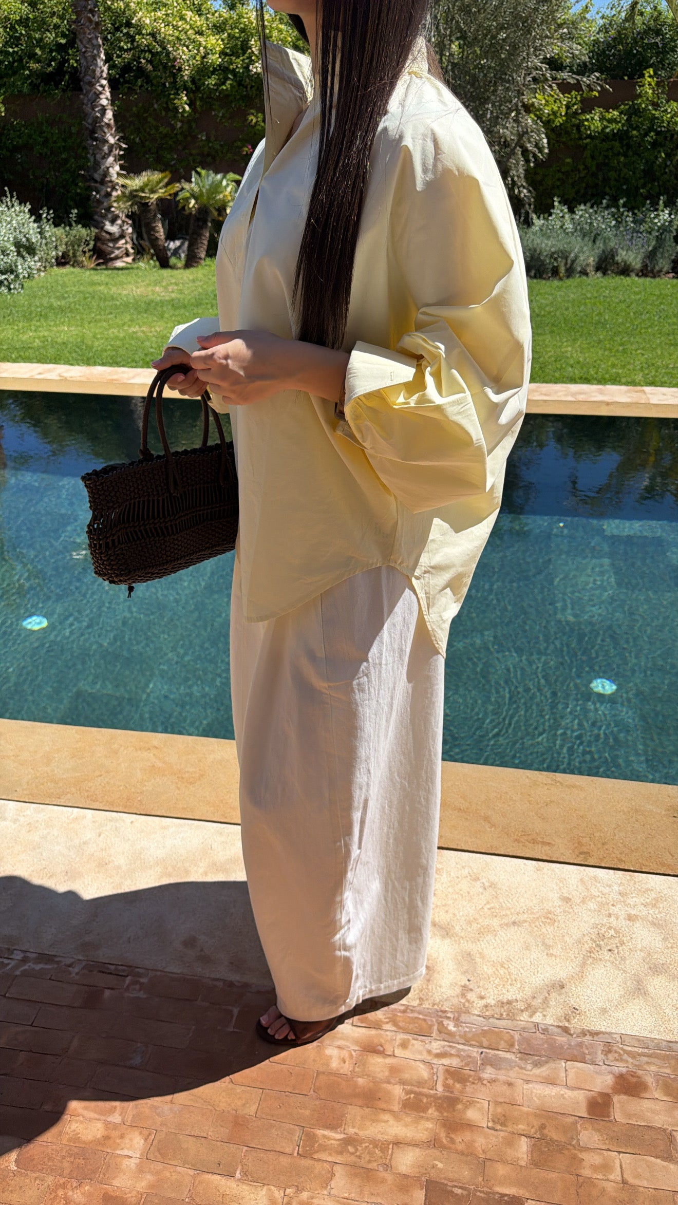 White flared trousers with belt